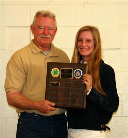 FFA member holding plaque 